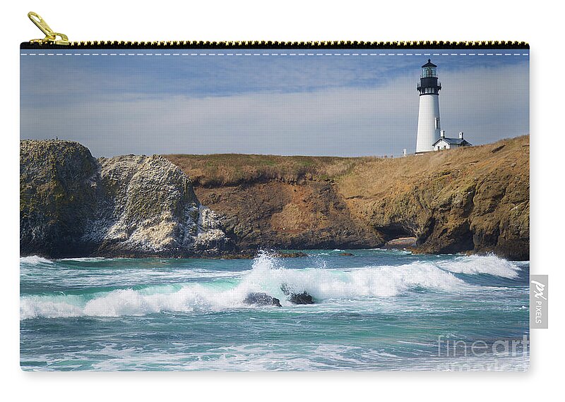 Yaquina Head Lighthouse Zip Pouch featuring the photograph Yaquina head lighthouse on the Oregon coast by Bruce Block