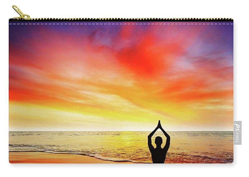 Beach Zip Pouch featuring the photograph Yoga at sunset by Paulo Goncalves
