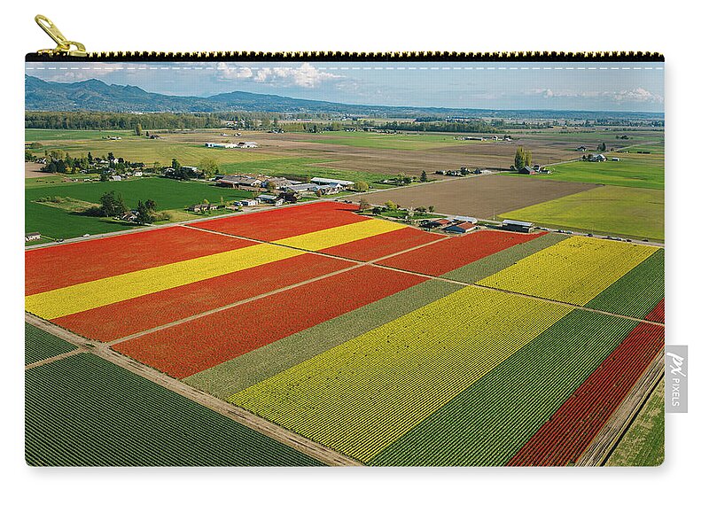 Scenics Zip Pouch featuring the photograph Aerial View Of Colorful Tulip Fields #1 by Pete Saloutos