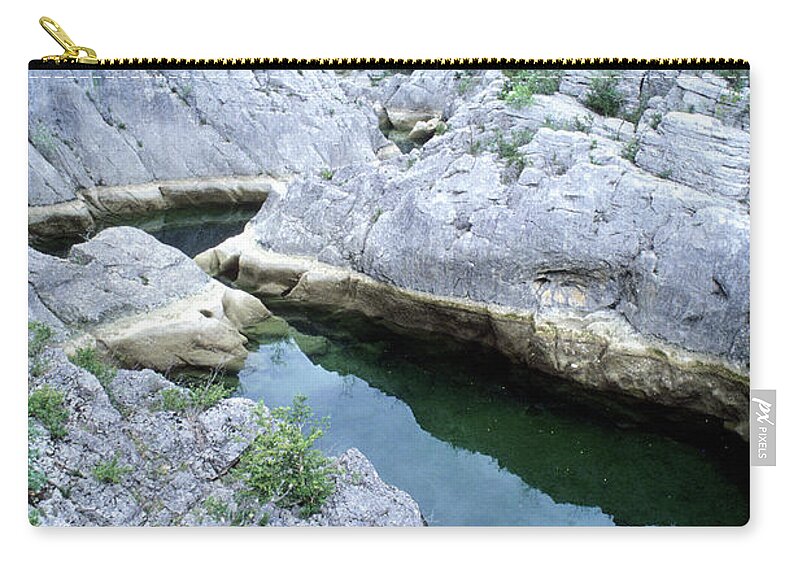 Tranquility Zip Pouch featuring the photograph Arcs Of The Ravine Is A Narrow Canyon #1 by P. Eoche