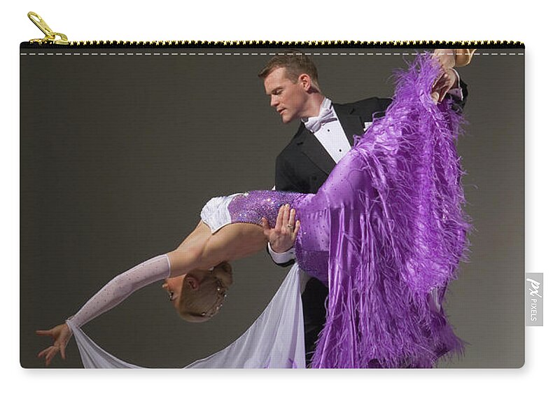 Teamwork Zip Pouch featuring the photograph Ballroom Dancing Pair Performing Dip #1 by Pm Images