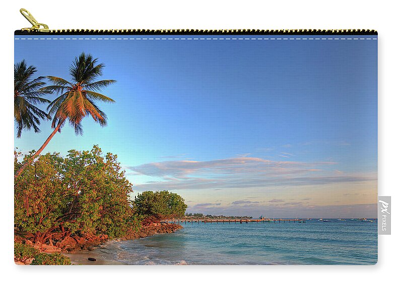 Tranquility Zip Pouch featuring the photograph Oistins Beach, Barbados #1 by Michele Falzone