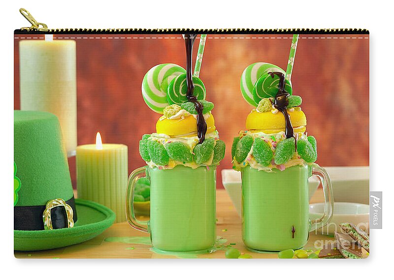 St Patricks Day Zip Pouch featuring the photograph St Patrick's Day on-trend holiday freak shakes with candy and lollipops. #1 by Milleflore Images