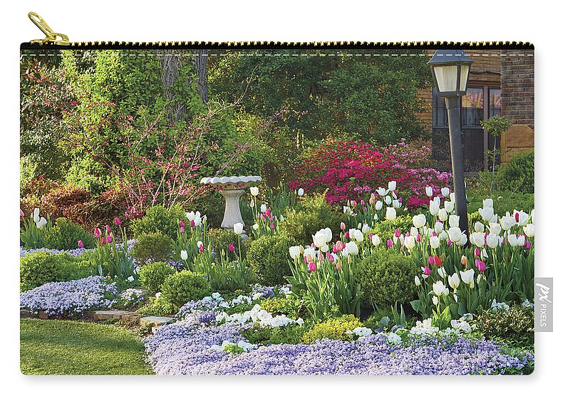 Tulips Zip Pouch featuring the photograph Tulip bed #1 by Garden Gate magazine