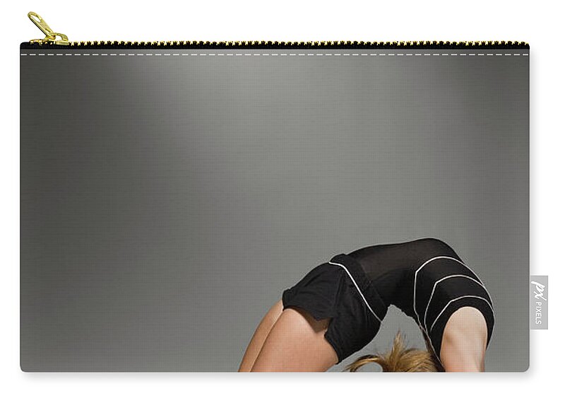 Recreational Pursuit Zip Pouch featuring the photograph Female Gymnast Stretching, Studio Shot #2 by Siri Stafford
