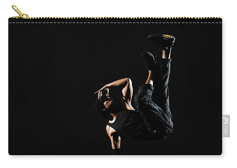 One Man Only Zip Pouch featuring the photograph Young Male Breakdancer Balancing On One #2 by Thomas Barwick