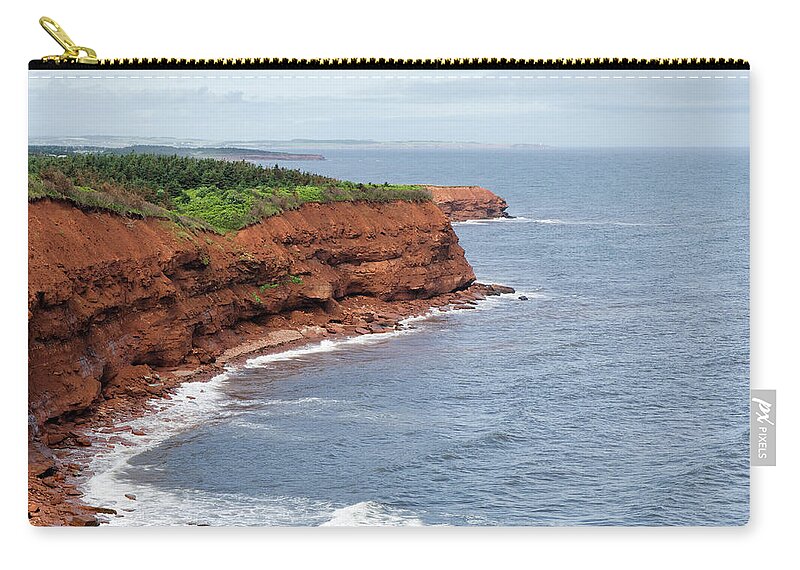 Water's Edge Zip Pouch featuring the photograph A Beautiful View Of An Eroded Sandstone by Brytta