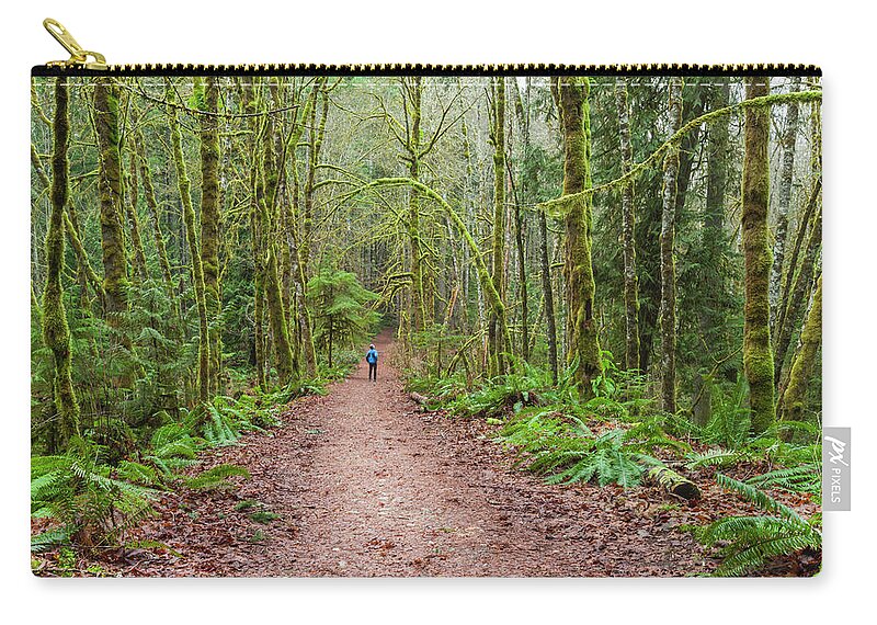 Tranquility Zip Pouch featuring the photograph A Man Looks Up At The Moss Covered by Debra Brash / Design Pics