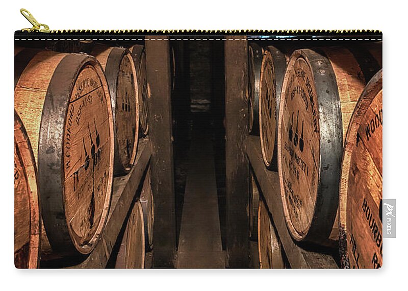 Woodford Reserve Zip Pouch featuring the photograph A Peek Between the Ricks by Susan Rissi Tregoning