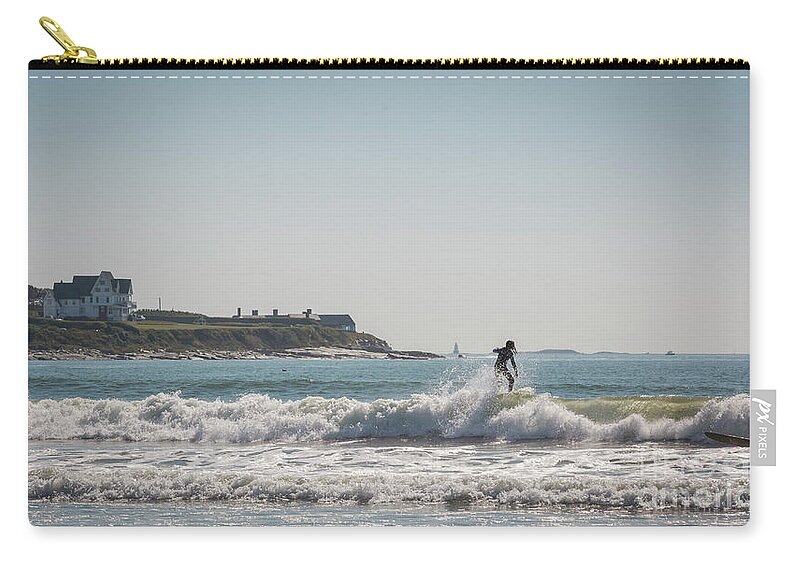 Surfer Zip Pouch featuring the photograph A surfer by Agnes Caruso