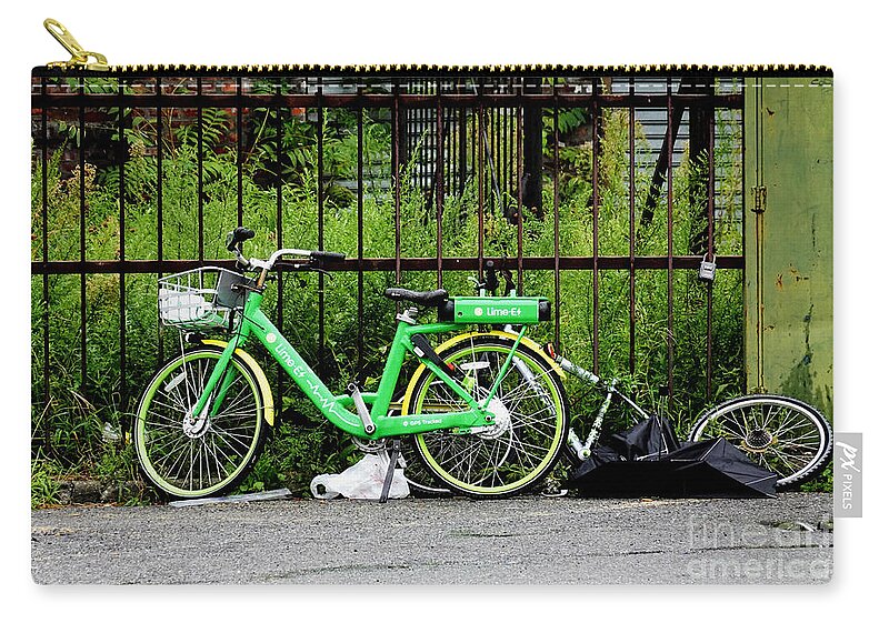 Electric-assist Bicycle Carry-all Pouch featuring the photograph A Welcome Splash of Lime on a Wet and Windy Day by Steve Ember