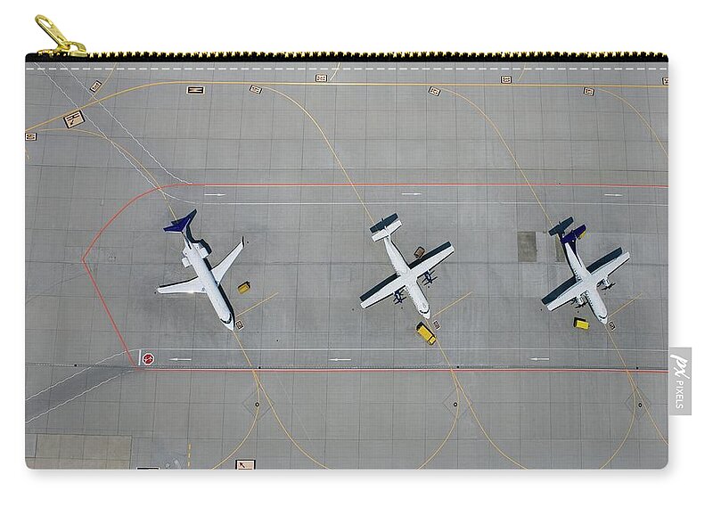 Shadow Zip Pouch featuring the photograph Aerial View Of Three Parked Airplanes by Stephan Zirwes