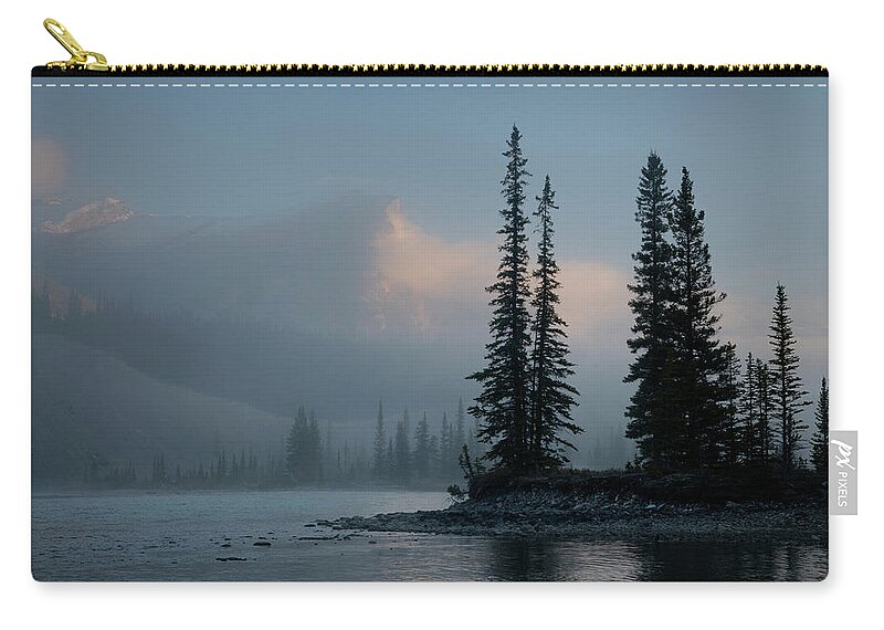 Banff Zip Pouch featuring the photograph Against a Morning Sky by Dan Jurak