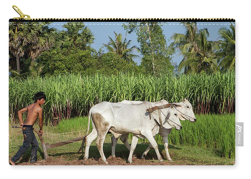 Working Zip Pouch featuring the photograph Asian Young Farmer Working The Field by Joakimbkk