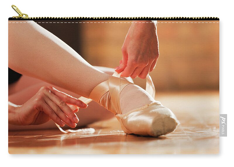 Expertise Zip Pouch featuring the photograph Ballet Dancer In Dance Studio, Foot by Yinyang