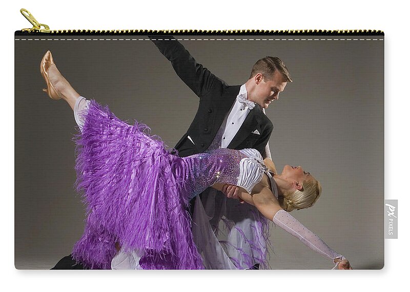 Teamwork Zip Pouch featuring the photograph Ballroom Dancing Pair Performing Dip by Pm Images