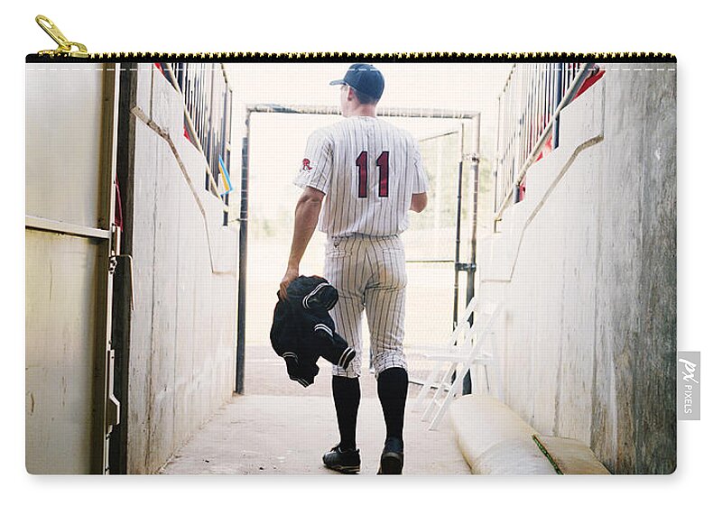 One Man Only Zip Pouch featuring the photograph Baseball Player Walking Through Stadium by Jim Bastardo