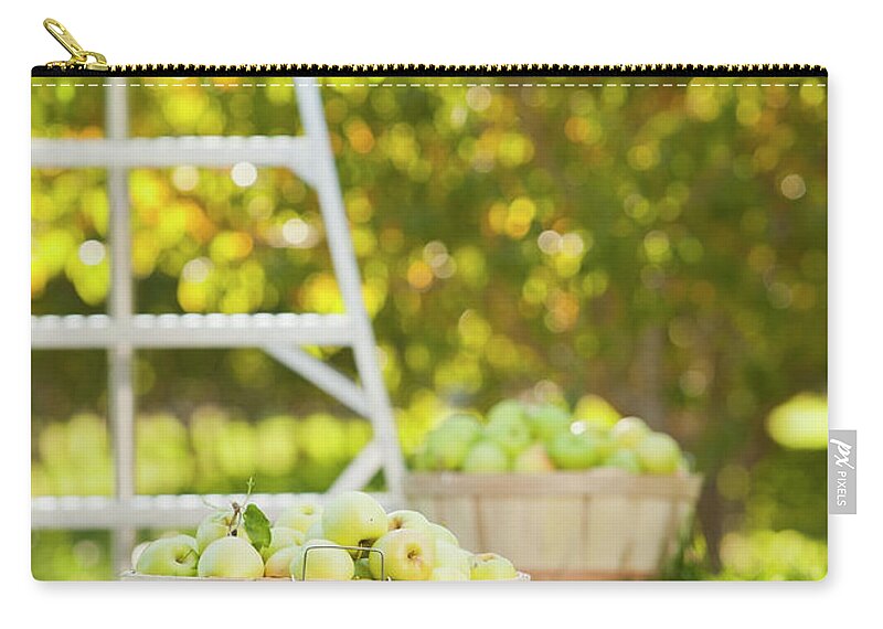 Heap Zip Pouch featuring the photograph Baskets Of Apples In Orchard by Mike Kemp