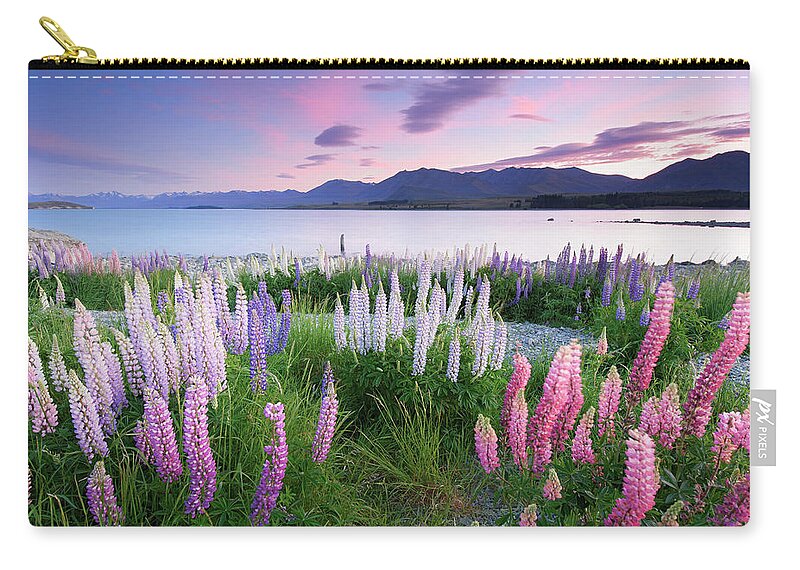 Dawn Zip Pouch featuring the photograph Berry Dawn At Lake Tekapo, New Zealand by Atomiczen