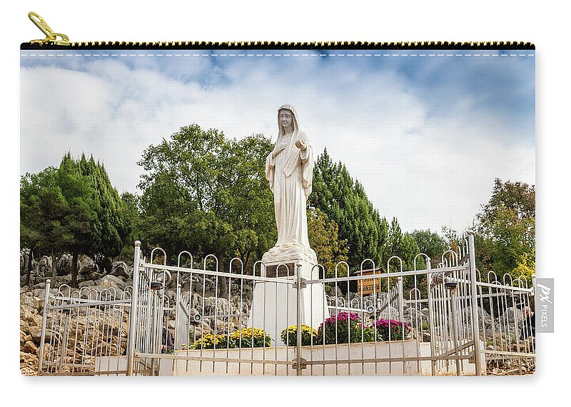 Apparition Zip Pouch featuring the photograph Blessed Virgin Mary Statue on Apparition hill by Vivida Photo PC