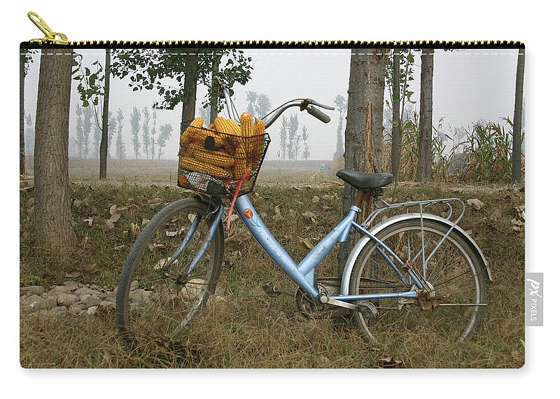 Bicycle Zip Pouch featuring the photograph A Solitary Blue Bicycle by Leslie Struxness