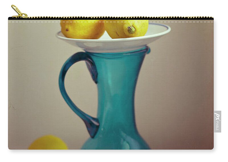Healthy Eating Zip Pouch featuring the photograph Blue Pitcher With Lemons On White Plate by Copyright Anna Nemoy(xaomena)