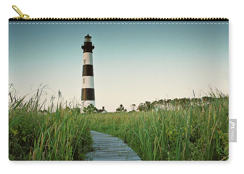 Grass Zip Pouch featuring the photograph Bodie Island Lighthouse by James Jordan Photography