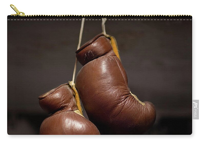 Boxing Gloves Hanging From Hook Zip Pouch by Christian Adams