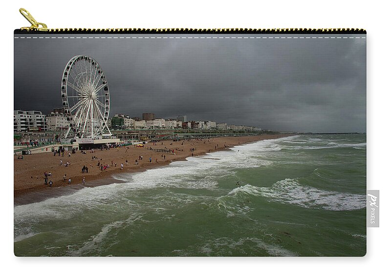 Water's Edge Zip Pouch featuring the photograph Brighton Beach On A Stormy Summer Day by Lucys28