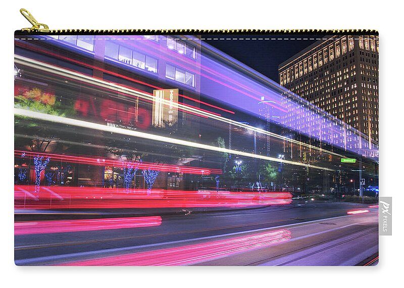 Detroit Zip Pouch featuring the photograph Bus trails in downtown Detroit... by Jay Smith