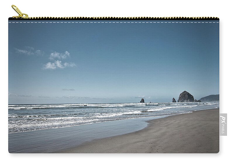Haystack Rock Zip Pouch featuring the photograph Cannon Beach, Oregon by G Lamar Yancy