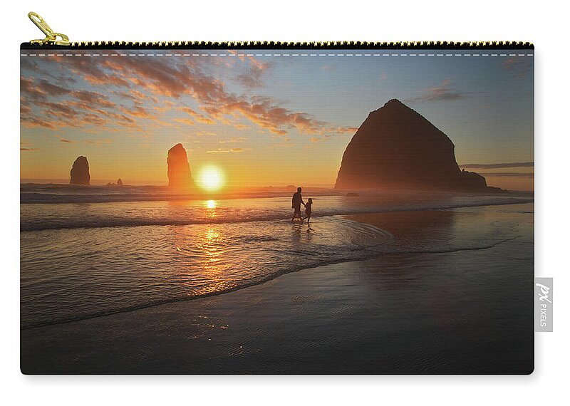 Water's Edge Zip Pouch featuring the photograph Cannon Beach, Oregon Sunset Walk by Kokophoto