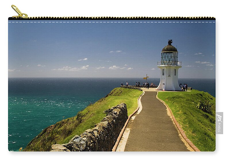 Scenics Zip Pouch featuring the photograph Cape Reinga, Lighthouse At The Edge Of by Yoav Peled