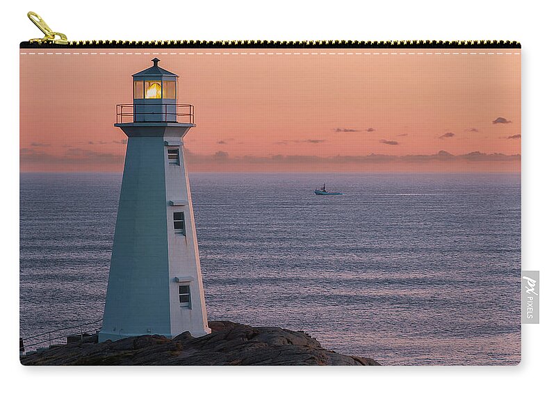 Built Structure Zip Pouch featuring the photograph Cape Spear Lighthouse And Boat by Ryan Desjardins Photography - Www.ryandesjardins.com
