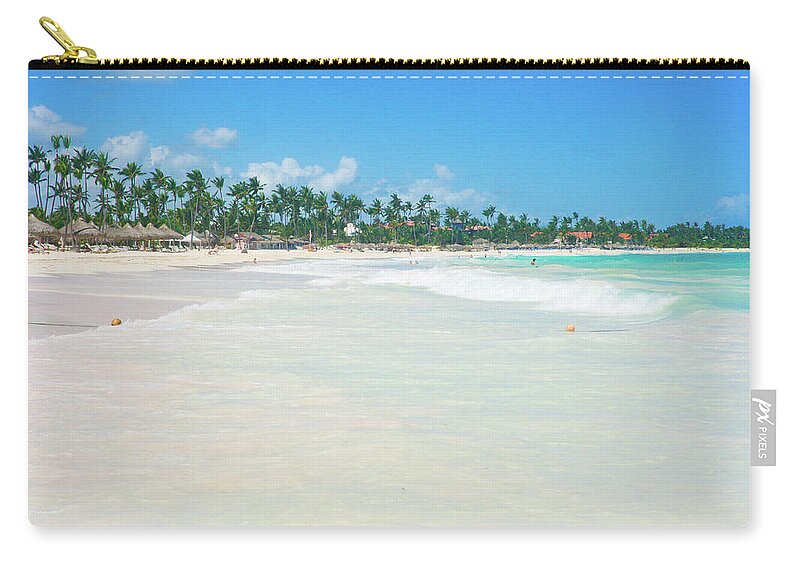 Scenics Zip Pouch featuring the photograph Carribean Beach Lined With Palm Trees by Raquel Lonas
