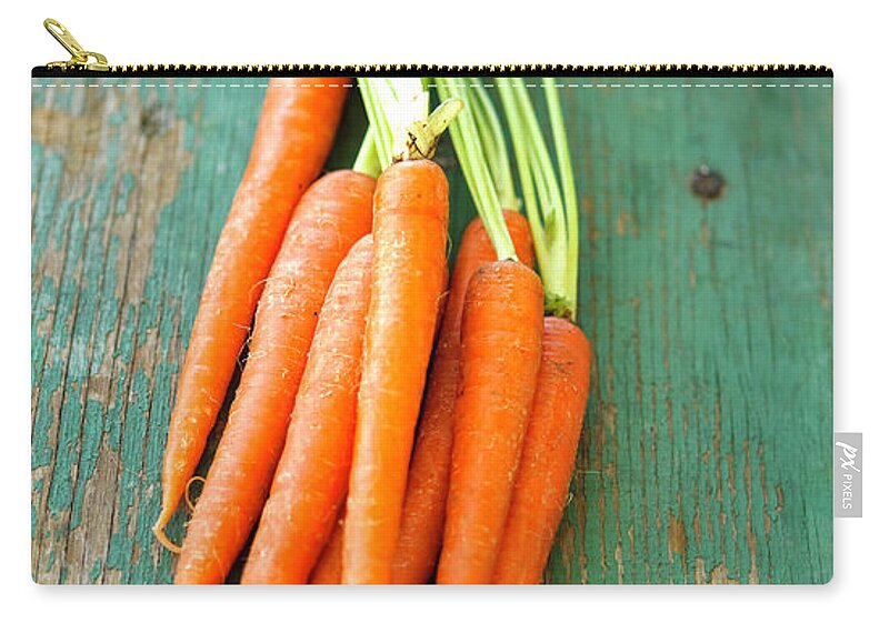 Juicy Zip Pouch featuring the photograph Carrots by Thepalmer