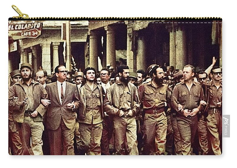 Che Guevara third from left and Fidel Castro far left marching to