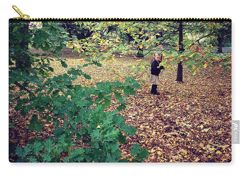 Scenics Zip Pouch featuring the photograph Child Playing In Garden Full Of Autumn by Jodie Griggs