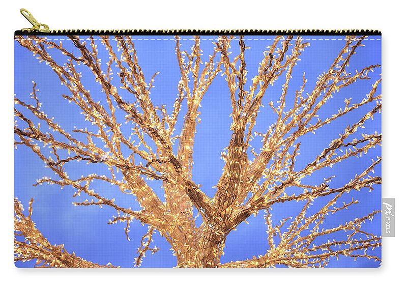 Clear Sky Zip Pouch featuring the photograph Christmas Tree Illuminated At Dusk by Vincenzo Lombardo
