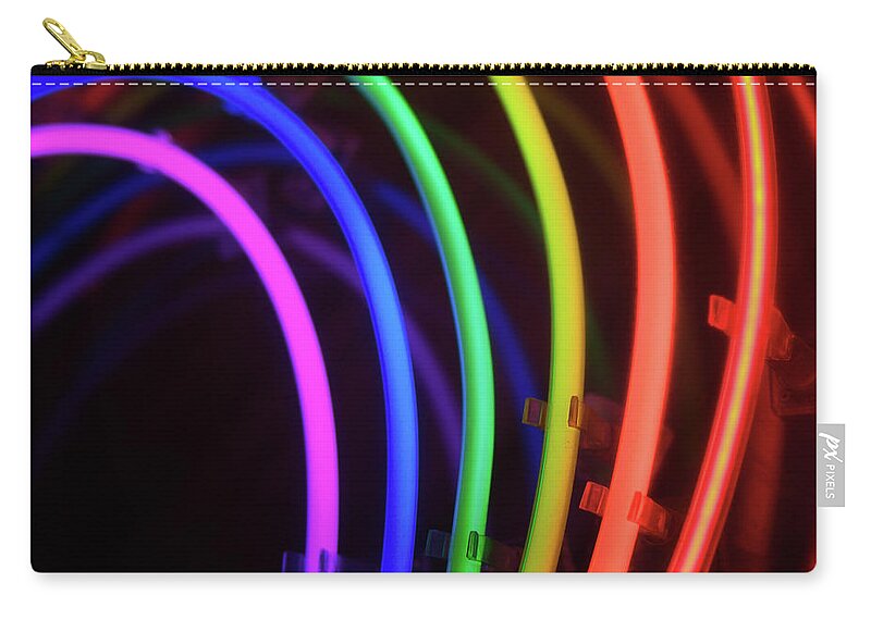 Orange Color Zip Pouch featuring the photograph Circles Of Neon Rainbow Light by Peskymonkey