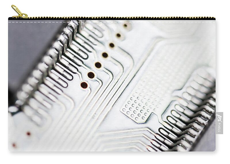 Electrical Component Zip Pouch featuring the photograph Close-up Of A Circuit Board by Nicholas Rigg
