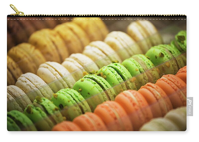 Unhealthy Eating Zip Pouch featuring the photograph Close Up Of Coloured Macaroons In Store by Michael Interisano / Design Pics