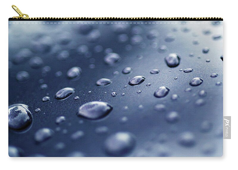 Natural Pattern Zip Pouch featuring the photograph Close-up Of Water Droplets On A Surface by Medioimages/photodisc