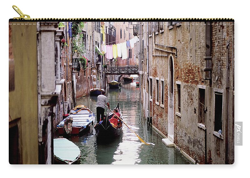 Hanging Zip Pouch featuring the photograph Clothes Hanging Over Ghetto Canal by Medioimages/photodisc