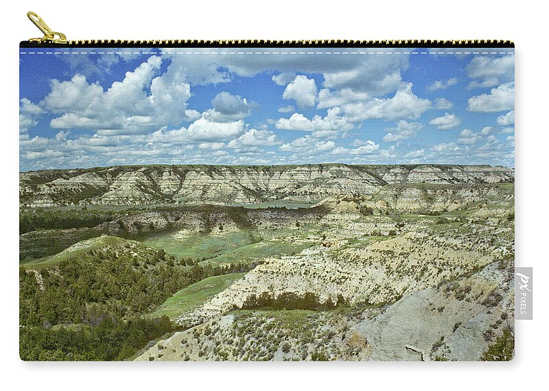 Scenics Zip Pouch featuring the photograph Cloud Formation Over A Badland Canyon by Jeffgoulden