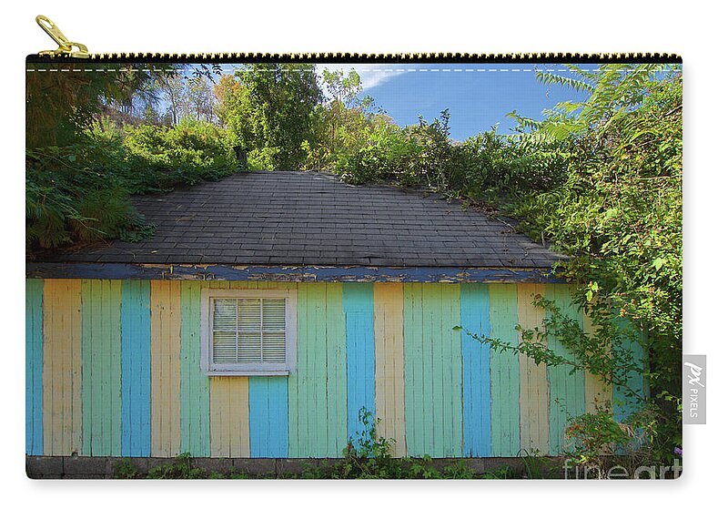 Hut Zip Pouch featuring the photograph Colorful Building In The Bushes by Mark Miller