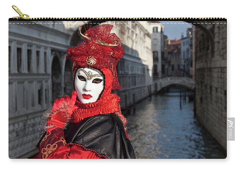 Mid Adult Women Zip Pouch featuring the photograph Costumed Figure At Venice Carnival by Cultura Rm Exclusive/walter Zerla
