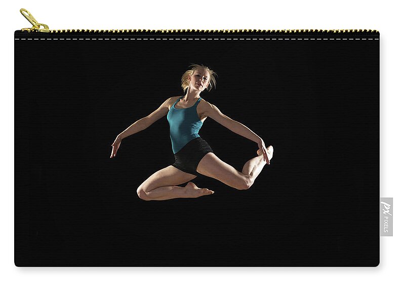 Ballet Dancer Zip Pouch featuring the photograph Dancer Jumping On Black Background by Phil Payne Photography