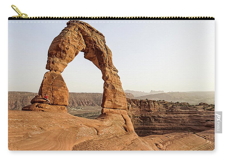 Scenics Zip Pouch featuring the photograph Delicate Arch In Arches National Park by Daniel Osterkamp