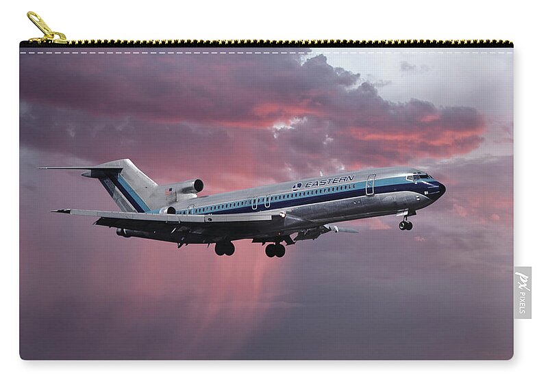 Eastern Airlines Zip Pouch featuring the photograph Eastern Boeing 727-225 Landing in a Winter Storm Sunset by Erik Simonsen
